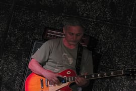 Pino Siciliano performs masterfully on guitar