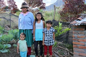 Cruz Maria Lopez With Grand Daughters in Her Garden