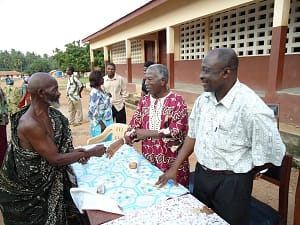 Nii Kweidza Mansa III, Chief of Otinibi, (On Left) Greets a Village Elder