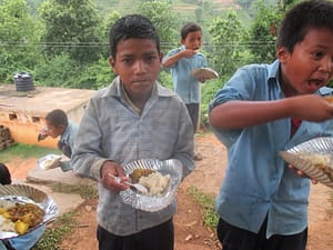 Students at Liding-Mahakali School enjoy their free meals.