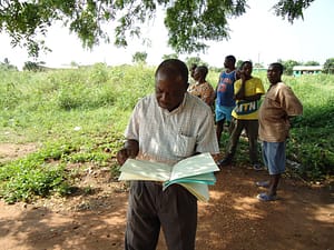 Emmanuel checking the document