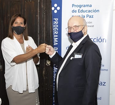 Representatives of The Prem Rawat Foundation and the National Institute for Juvenile Social Inclusion fist bump in support of the Peace Education Program.