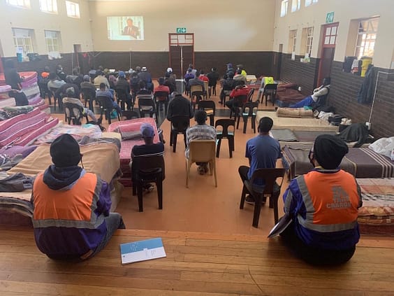 People participate in the Peace Education Program at a homeless shelter in Johannesburg.