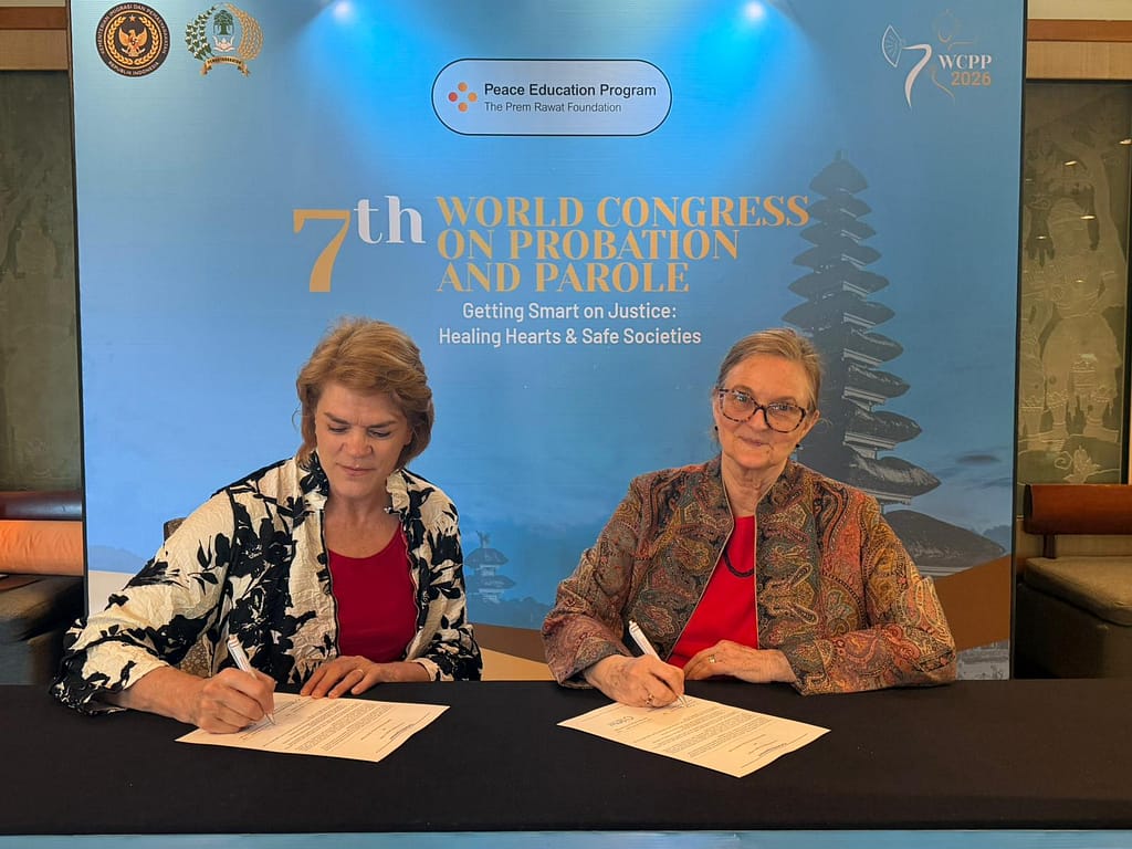 Representatives of the Saw Project and TPRF sign an agreement to support the Peace Education Program.