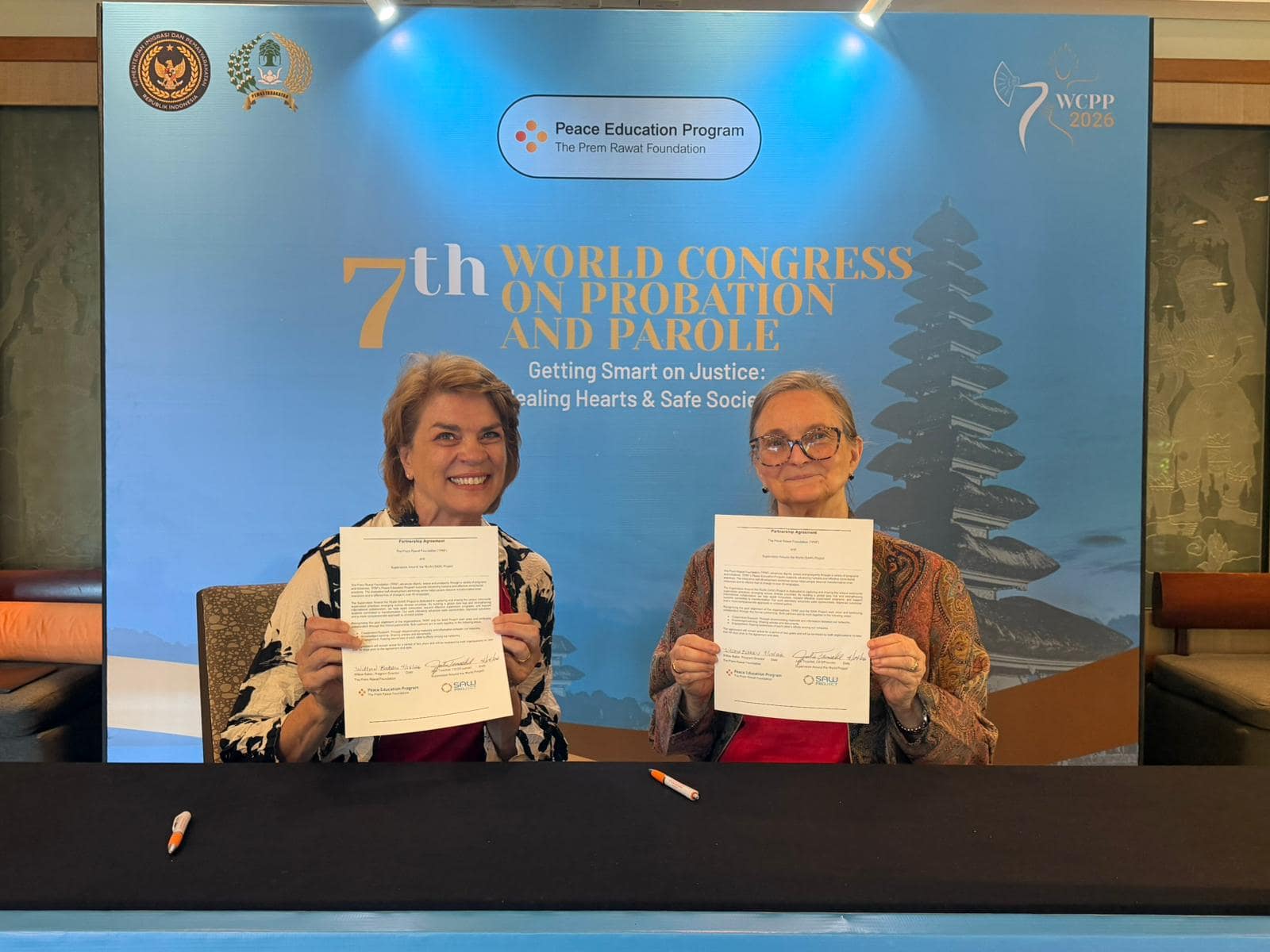 Saw Project partnership Representatives of the Saw Project and TPRF sign an agreement to support the Peace Education Program.