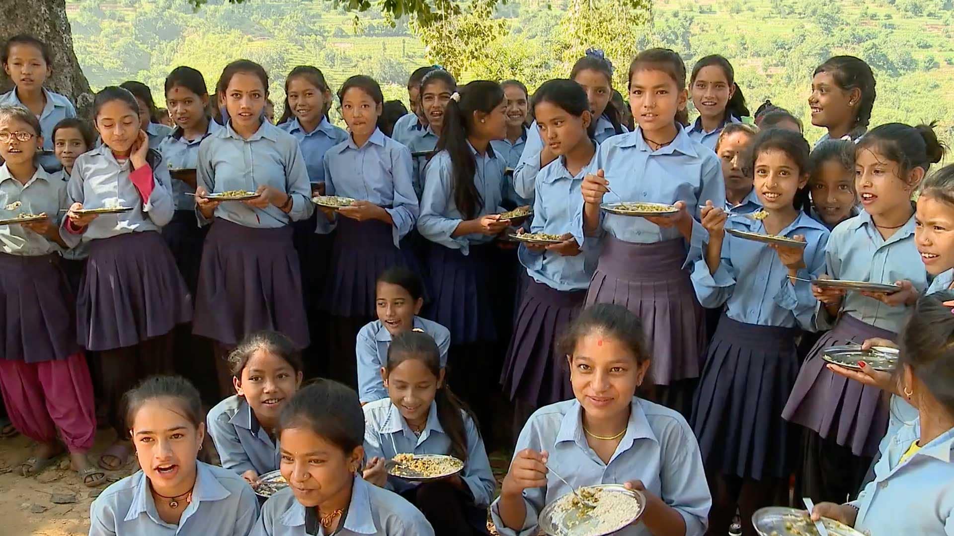 A group of children enjoy meals served by the Food for People program.