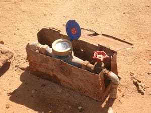 Meter Attaches to Well Tap Meter Attaches to Well Tap