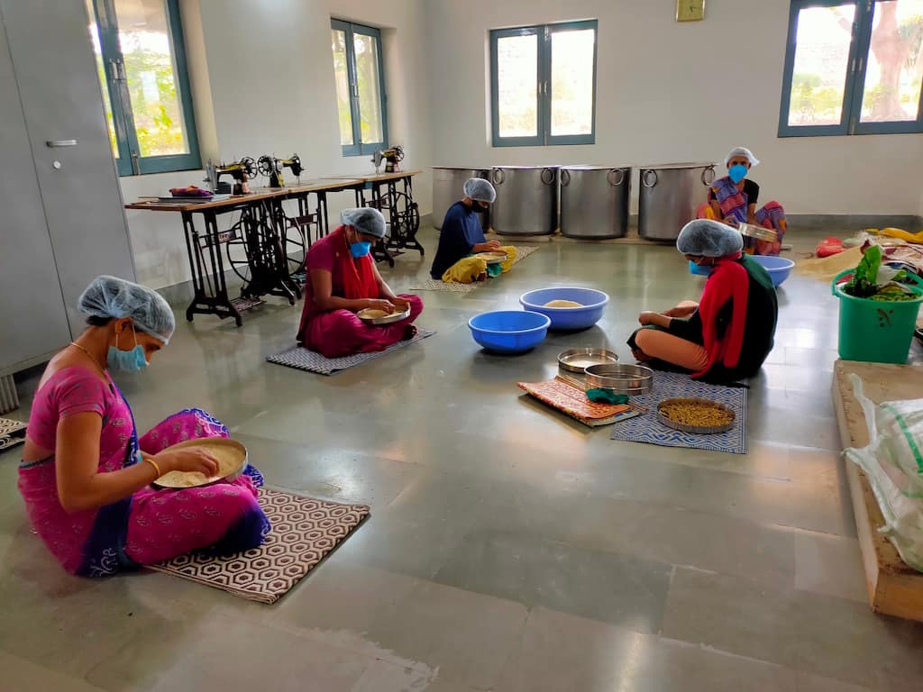 Food for People volunteers prepare foods for the disabled in India